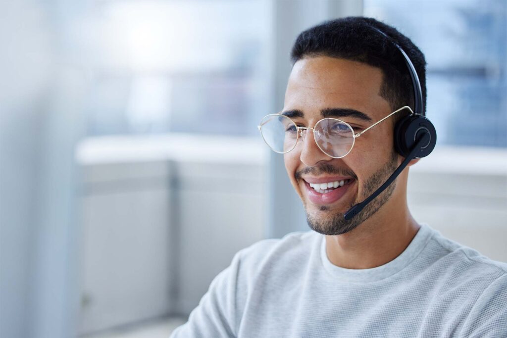 Blog image showing call centre employee on headset.